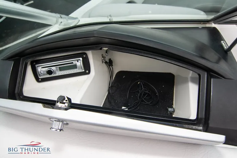 Slide: The Image of 2005 MasterCraft X45 boat dashboard storage compartment with stereo system. - 40