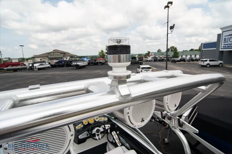 Slide: The Image of 2005 MasterCraft X45 boat dashboard and tower with speakers in a dealership lot. - 49