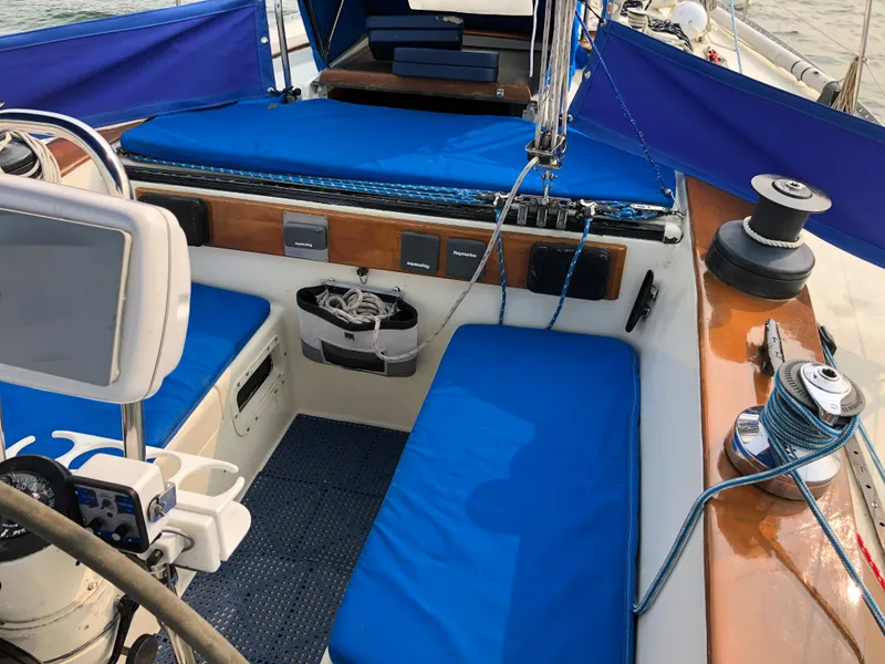 Slide: The Image of 1978 Palmer Johnson New York 40 Sloop with blue seating and navigation equipment. - 11