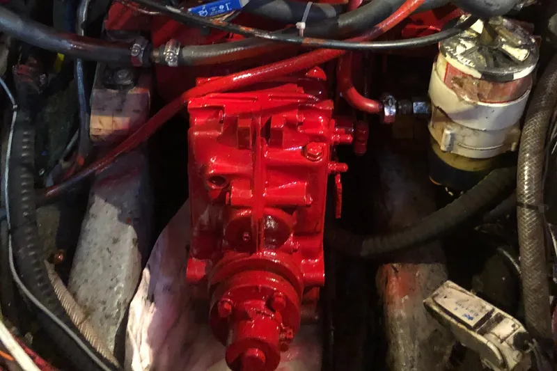 Slide: The Image of Engine compartment of a 1978 Palmer Johnson New York 40 Sloop, featuring red-painted components. - 15