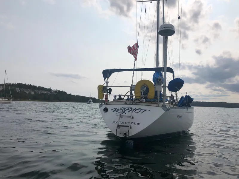 Slide: The Image of Palmer Johnson New York 40 Sloop, 1978, anchored in calm waters under a cloudy sky. - 18