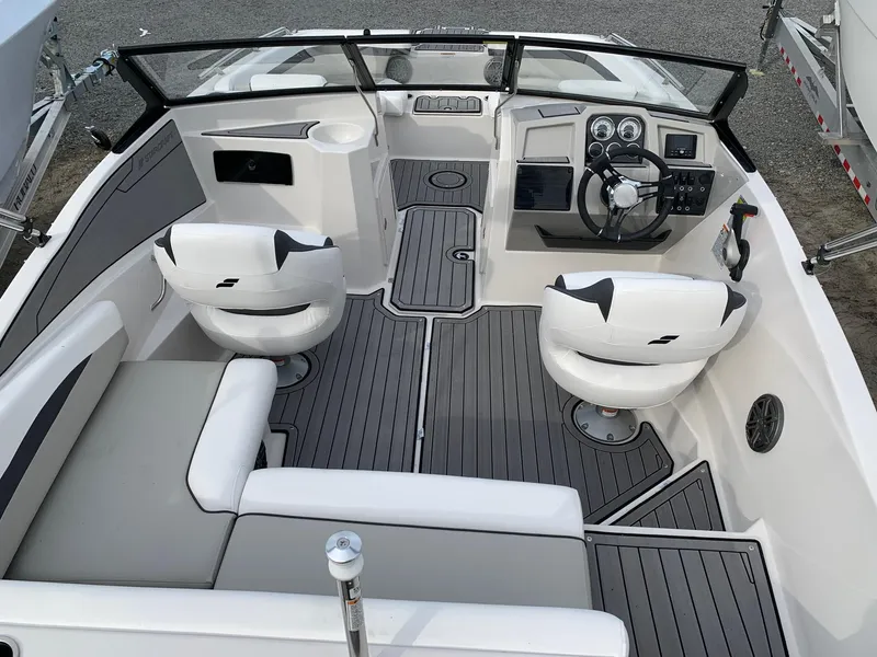 Slide: The Image of 2026 Starcraft SVX 190 boat interior with modern seating and sleek dashboard design. - 15