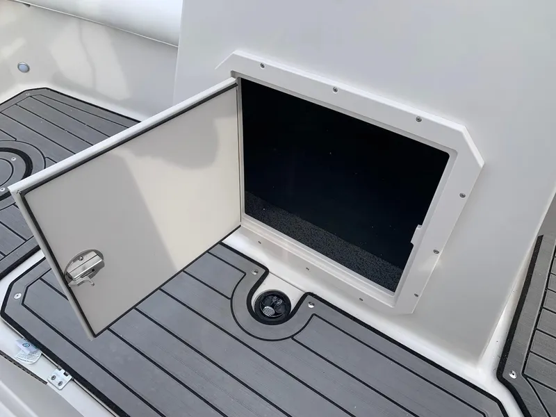 Slide: The Image of Open storage compartment on 2026 Starcraft SVX 190 boat deck. - 5