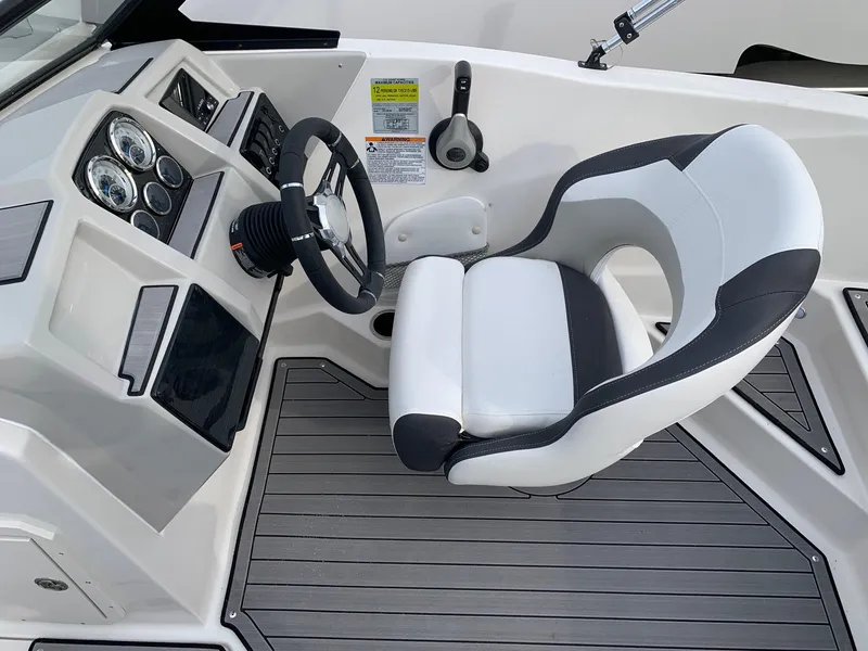 Slide: The Image of 2026 Starcraft SVX 190 boat cockpit with modern steering wheel and comfortable seating. - 6
