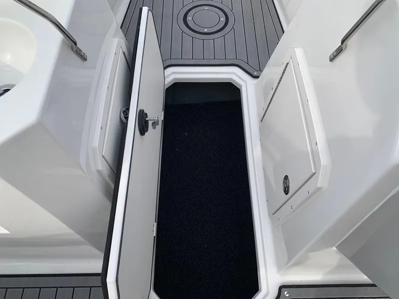 Slide: The Image of Open storage compartment on 2026 Starcraft SVX 190 boat deck. - 7
