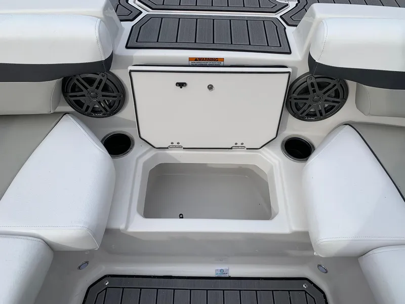 Slide: The Image of 2026 Starcraft SVX 190 boat interior with seating, storage, and cup holders. - 9