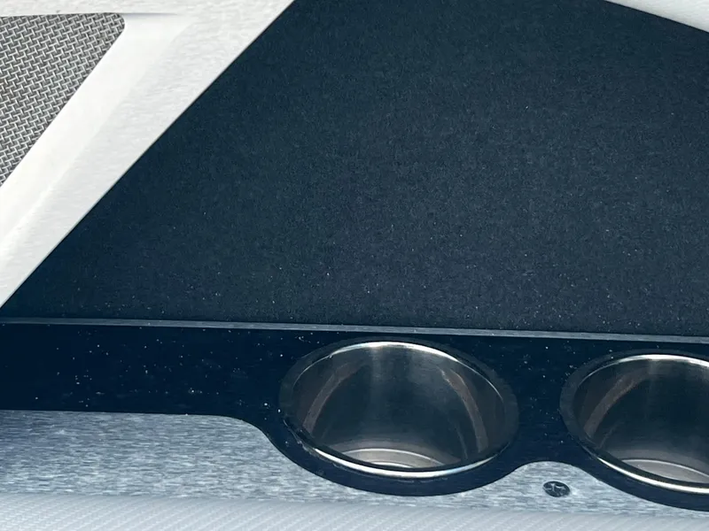 Slide: The Image of Interior cup holders of a 2014 MasterCraft X-55 boat. - 10