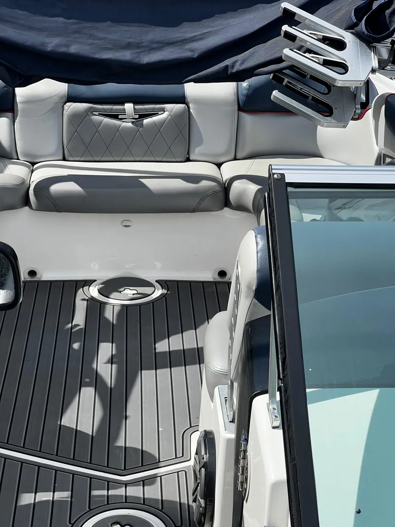 Slide: The Image of 2014 MasterCraft X-55 boat interior with gray seating and deck. - 13