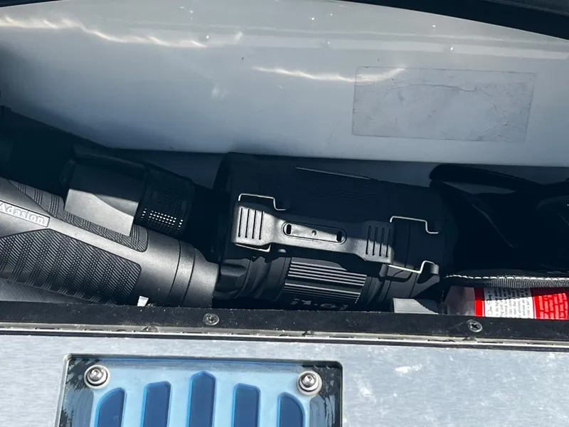 Slide: The Image of Storage compartment of a 2014 MasterCraft X-55 boat with equipment. - 16