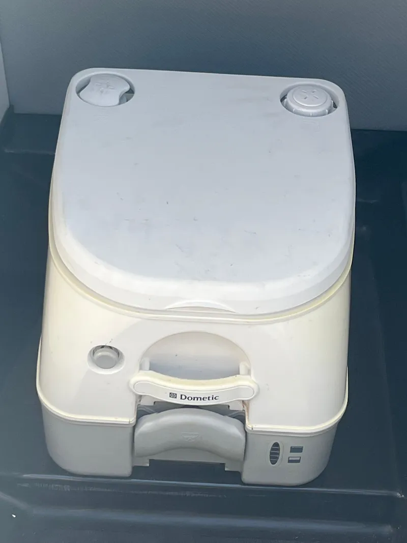 Slide: The Image of Portable Dometic toilet in a 2014 MasterCraft X-55 boat. - 18