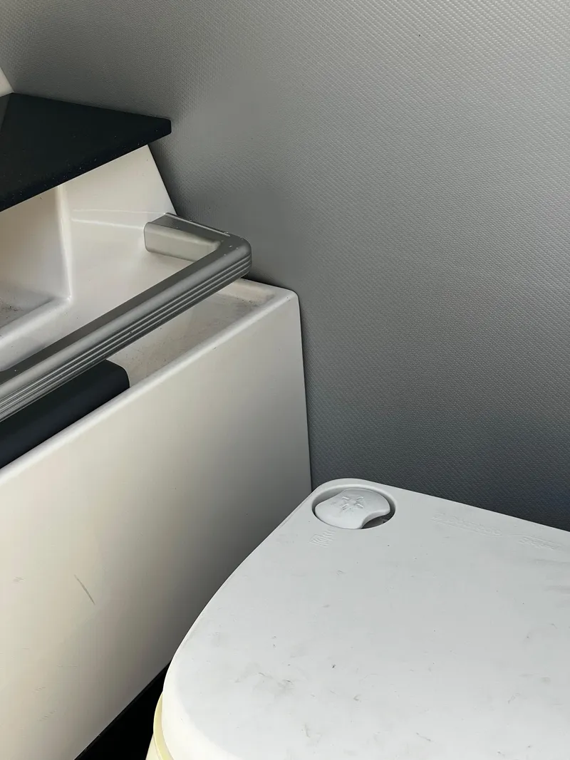 Slide: The Image of MasterCraft X-55 2014 boat bathroom with toilet and sink. - 19