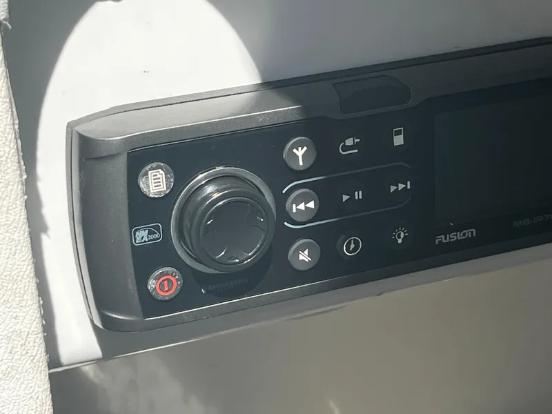 Slide: The Image of Close-up of Fusion MS-IP700i marine stereo control panel on 2014 MasterCraft X-55 boat. - 21