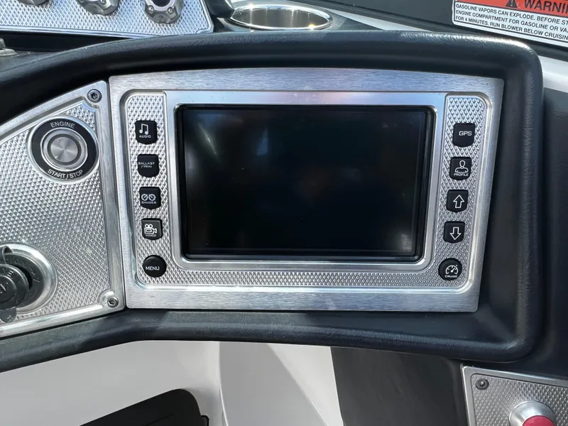 Slide: The Image of 2014 MasterCraft X-55 boat dashboard with touchscreen and control buttons. - 26