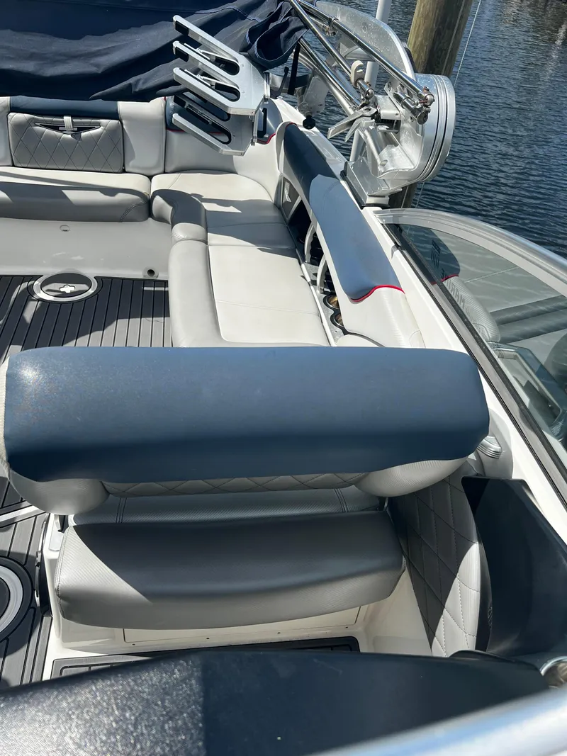 Slide: The Image of Interior seating of a 2014 MasterCraft X-55 boat with gray and white upholstery. - 32