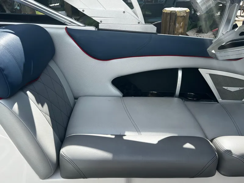 Slide: The Image of 2014 MasterCraft X-55 boat interior with gray and blue seating. - 33