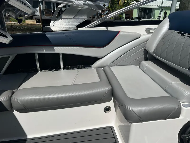 Slide: The Image of 2014 MasterCraft X-55 boat interior with gray leather seating and diamond stitching. - 34