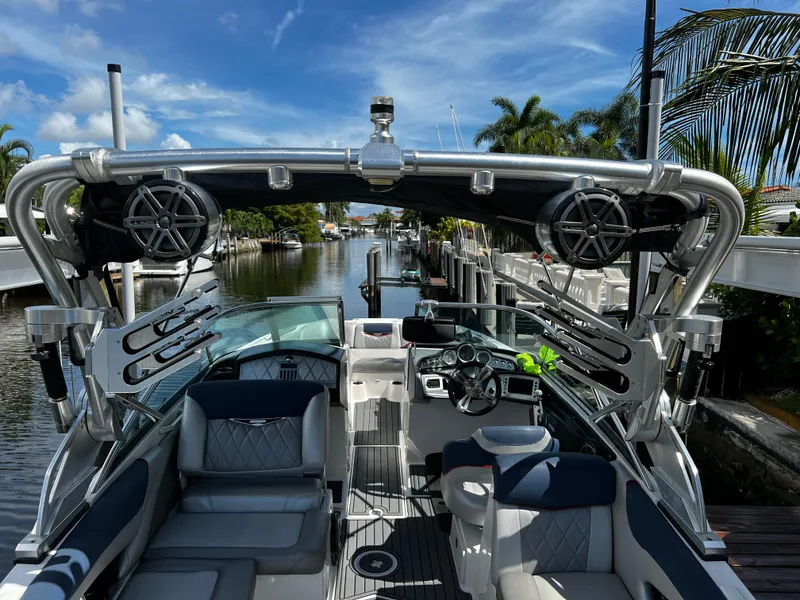 Slide: The Image of 2014 MasterCraft X-55 boat interior with advanced sound system and sleek design. - 38
