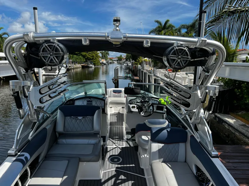 Slide: The Image of 2014 MasterCraft X-55 boat interior with luxury seating and advanced audio system. - 39
