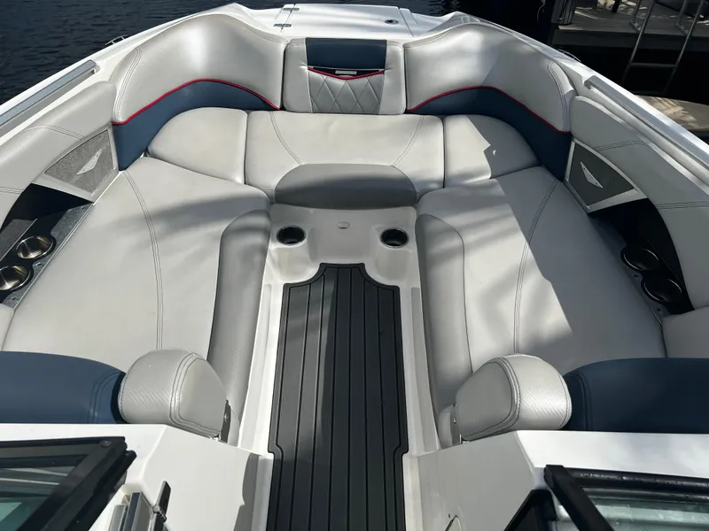 Slide: The Image of 2014 MasterCraft X-55 boat interior with spacious seating and cup holders. - 4