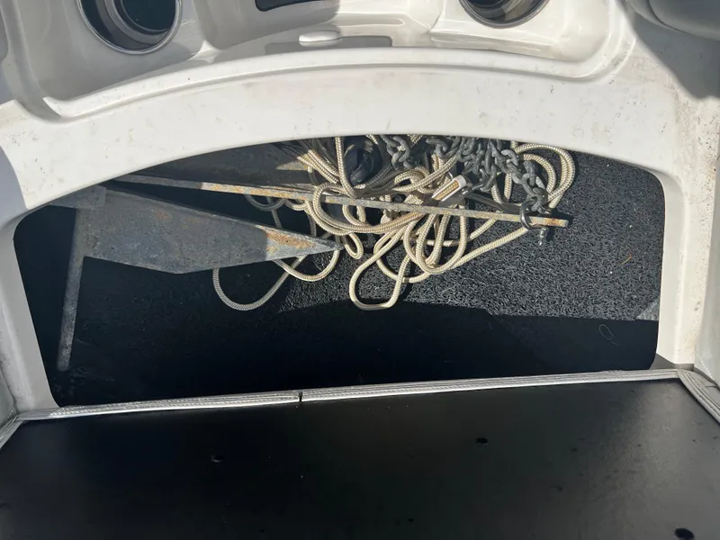 Slide: The Image of Anchor and ropes in storage compartment of 2014 MasterCraft X-55 boat. - 8