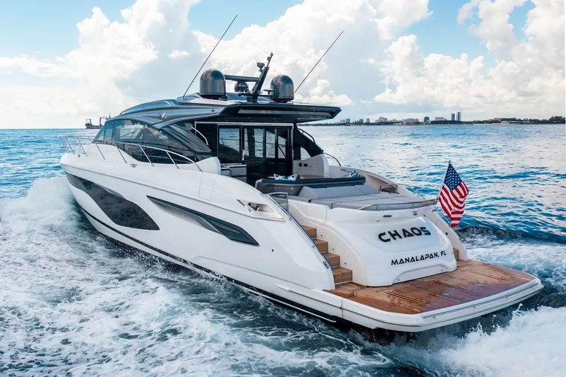 Slide: The Image of The 2020 Princess V60 cruising on the sea with an American flag at the stern. - 5