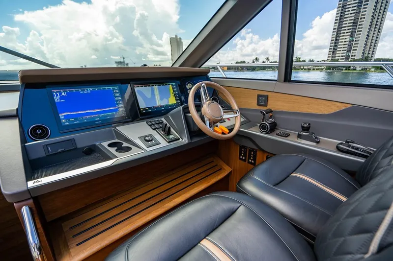 Slide: The Image of The 2020 Princess V60 cockpit features modern navigation systems and luxurious leather seating. - 22