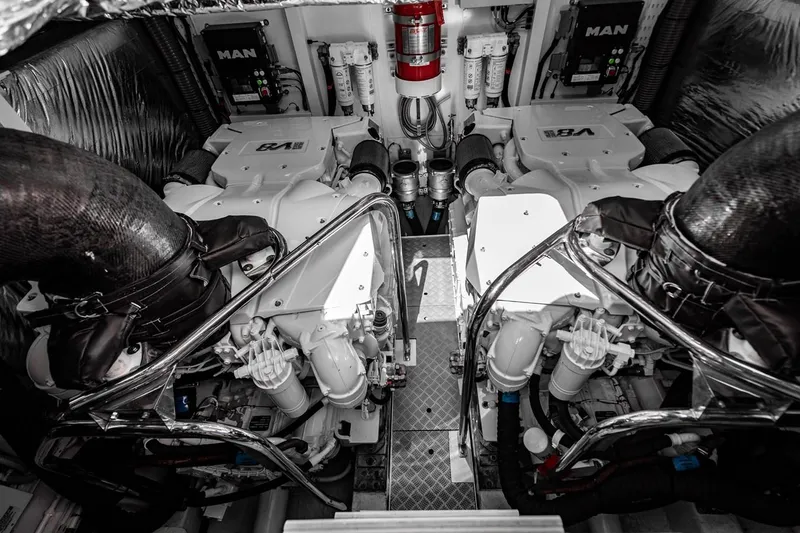 Slide: The Image of Engine room of the 2020 Princess V60 with two MAN engines and a fire extinguisher. - 29