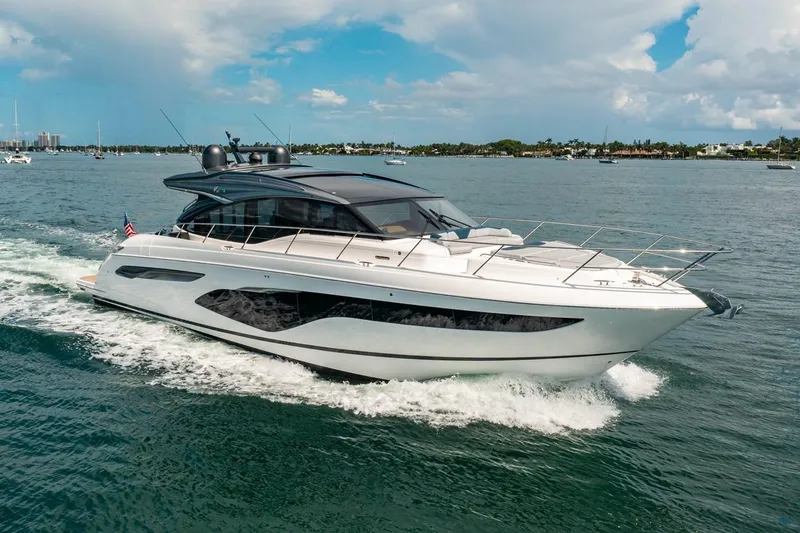 Slide: The Image of The 2020 Princess V60 cruising on the water, featuring sleek design and spacious deck. - 1