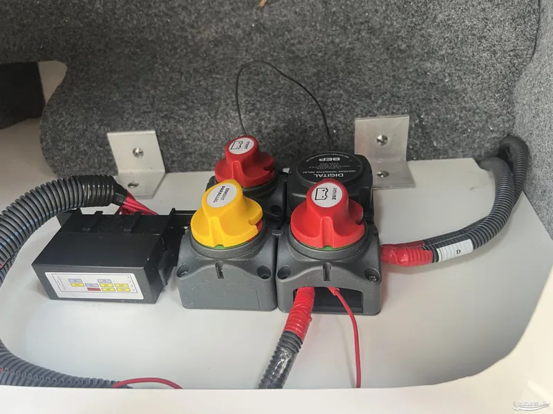 Slide: The Image of Electrical system components in a 2025 Yamaha Boats 252SE, featuring switches and wiring. - 8