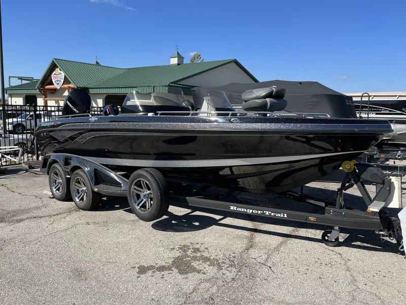 Slide: The Image of 2023 Ranger 620FS Pro boat on a trailer in a parking lot. - 1