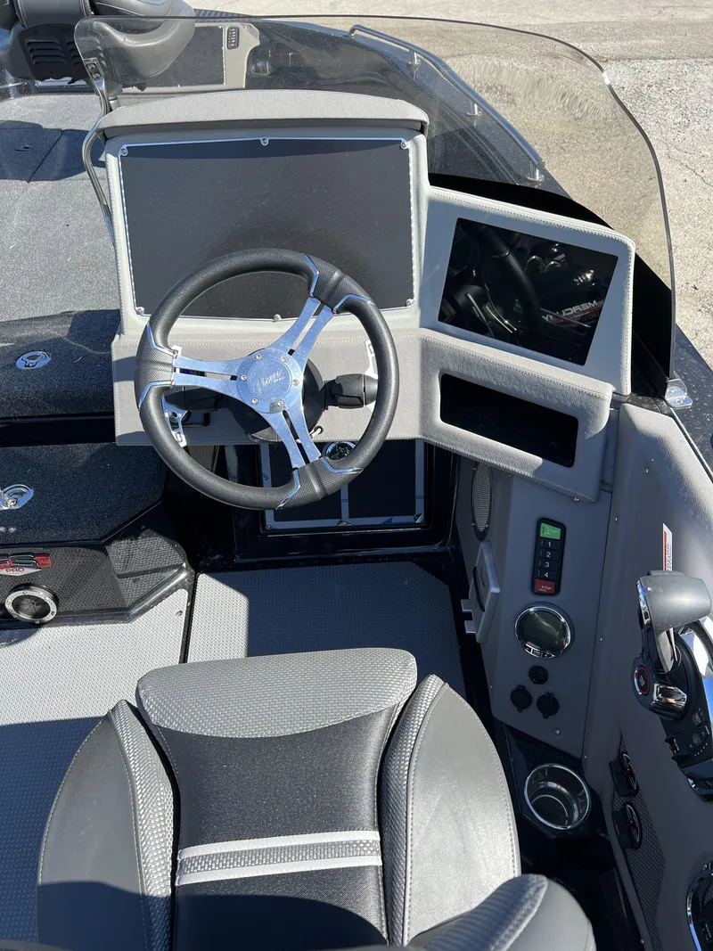 Slide: The Image of 2023 Ranger 620FS Pro boat dashboard with steering wheel and electronic displays. - 6