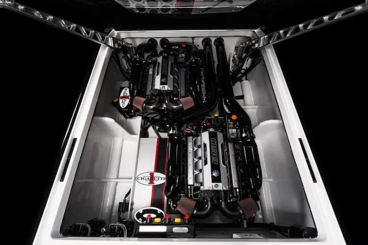 Slide: The Image of Cigarette 42' X 2025 model engine compartment with dual high-performance engines. - 11