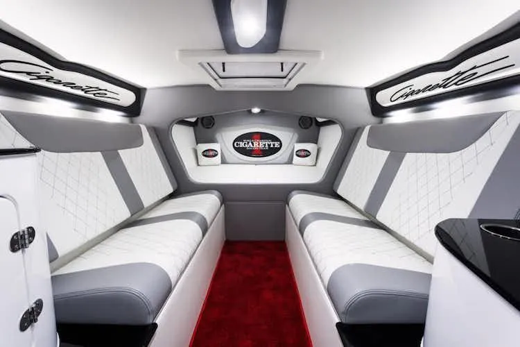 Slide: The Image of Luxurious interior of 2025 Cigarette 42' X boat with white and gray seating. - 13