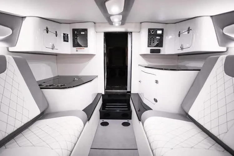 Slide: The Image of Luxurious interior of 2025 Cigarette 42' X boat with modern white and gray seating. - 14