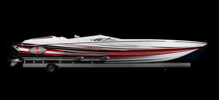 Slide: The Image of 2025 Cigarette 42' X speedboat with sleek red and white design on trailer. - 3