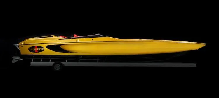 Slide: The Image of 2025 Cigarette 42' X speedboat in yellow and black on a trailer. - 5