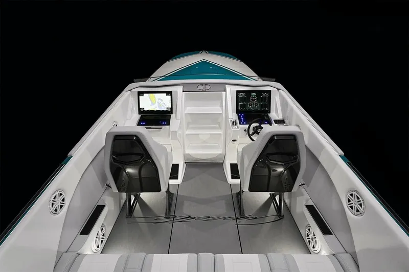 Slide: The Image of 2025 Cigarette 515 boat cockpit with dual seats, advanced navigation screens, and modern design. - 3