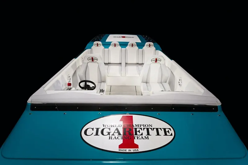Slide: The Image of 2025 Cigarette 515 racing boat interior with white seats and logo. - 6