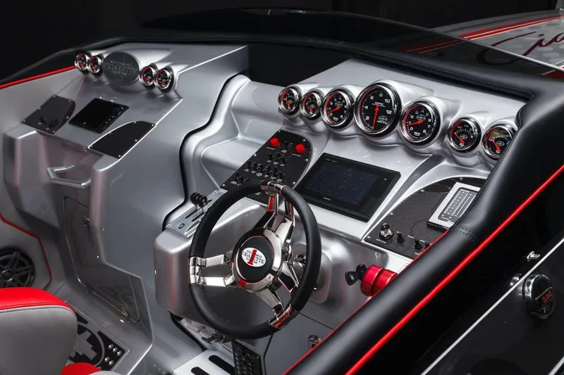 Slide: The Image of 2025 Cigarette 38 Top Gun boat dashboard with advanced controls and gauges. - 6