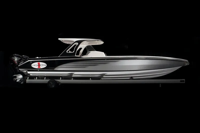 Slide: The Image of 2025 Cigarette 39 GTS boat, sleek design, black and white color scheme. - 5