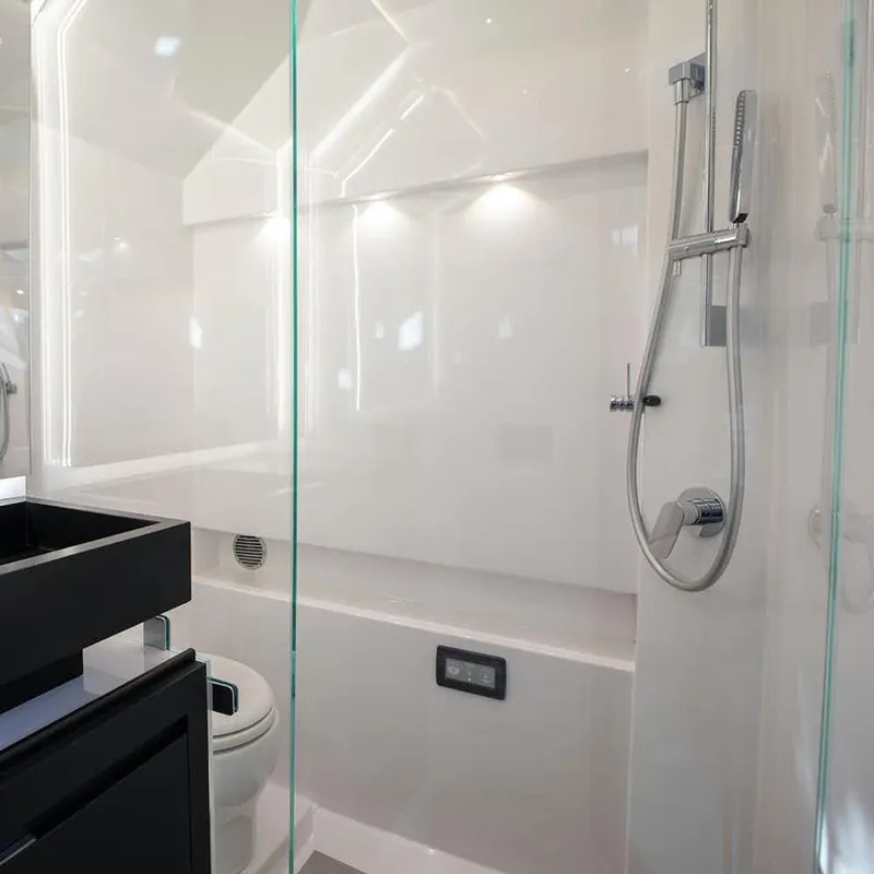 Slide: The Image of Modern bathroom in 2025 Cigarette 59 Tirranna boat with sleek shower and toilet. - 14