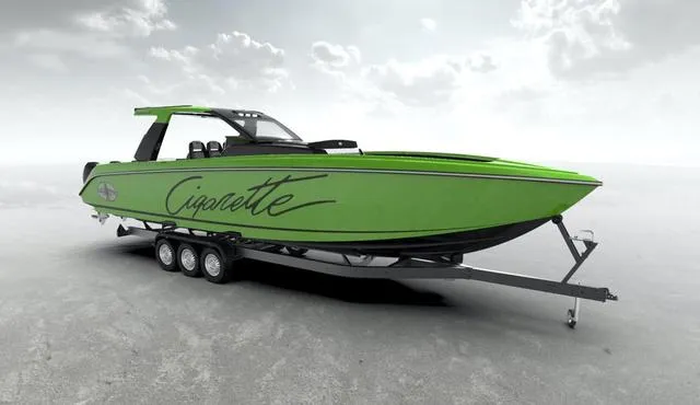 Slide: The Image of 2025 Cigarette 41 Nighthawk boat in vibrant green on a trailer. - 4