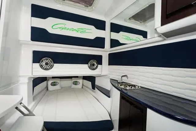 Slide: The Image of Interior cabin of 2025 Cigarette 41 Nighthawk boat with bed, sink, and speakers. - 5