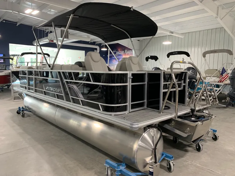 Slide: The Image of 2024 Starcraft EX22 FD pontoon boat in showroom. - 1
