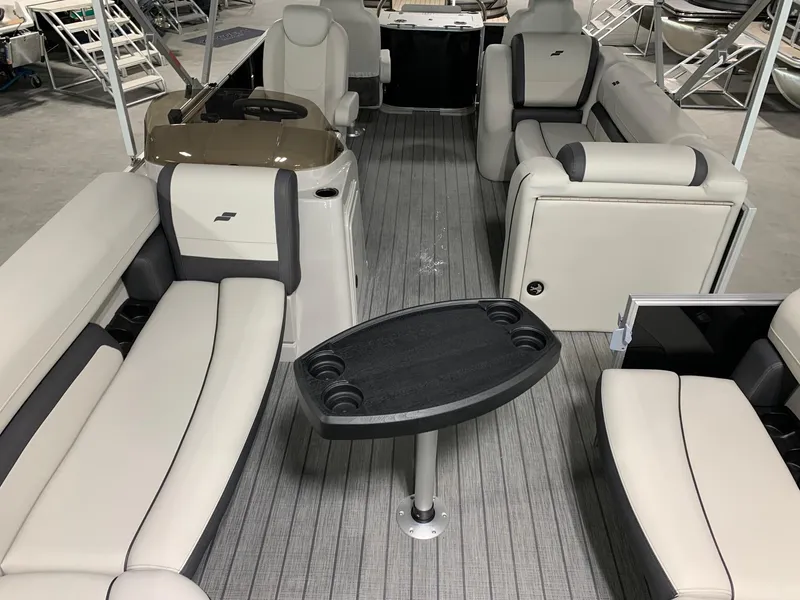 Slide: The Image of 2024 Starcraft EX22 FD pontoon boat interior with seating and table. - 12