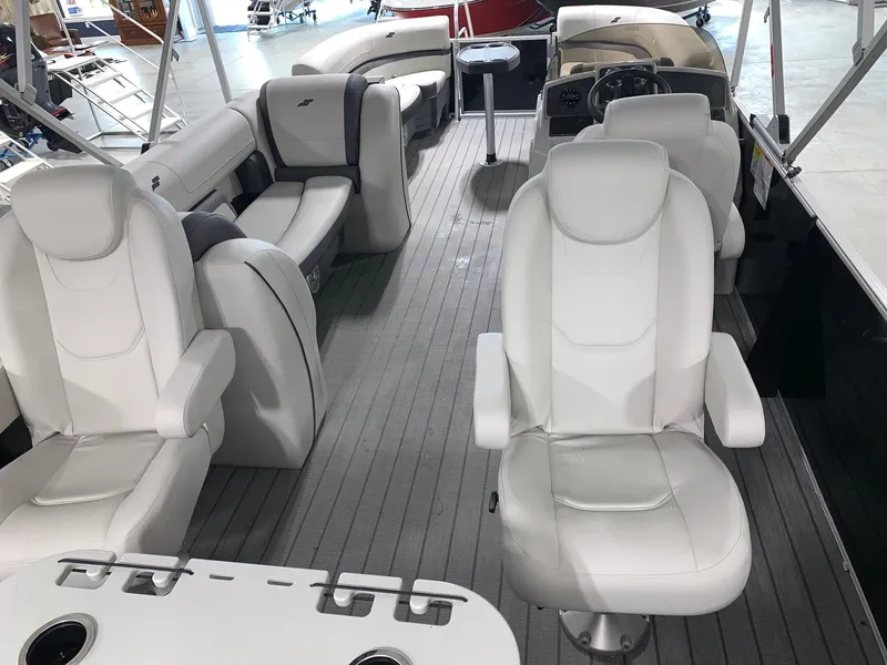 Slide: The Image of 2024 Starcraft EX22 FD boat interior with white leather seats and modern design. - 4