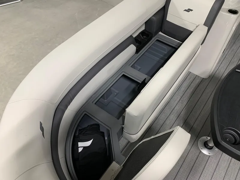 Slide: The Image of 2024 Starcraft EX22 FD boat interior with open storage compartments. - 11