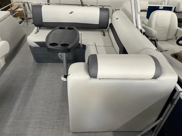 Slide: The Image of 2023 Starcraft EX 22 Q pontoon boat interior with gray and white seating. - 13