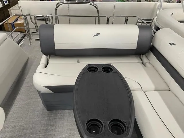 Slide: The Image of 2023 Starcraft EX 22 Q pontoon boat interior with seating and cup holders. - 15