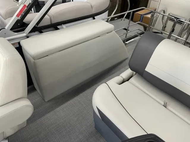 Slide: The Image of 2023 Starcraft EX 22 Q boat interior with gray and white seating. - 16